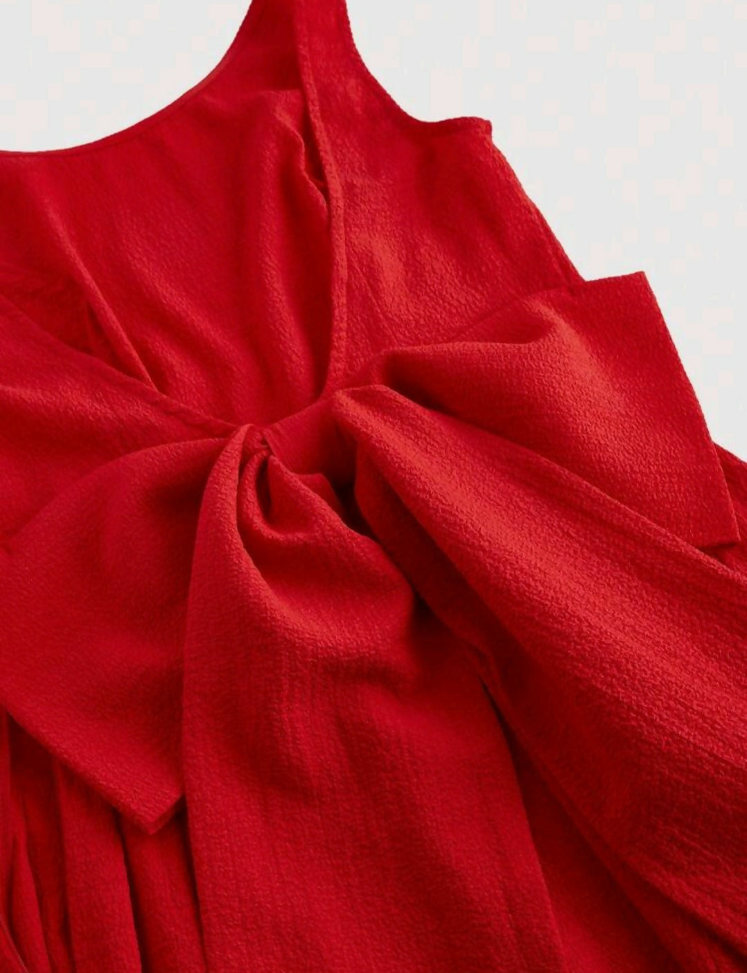 OPEN BACK DRESS WITH LARGE BOW