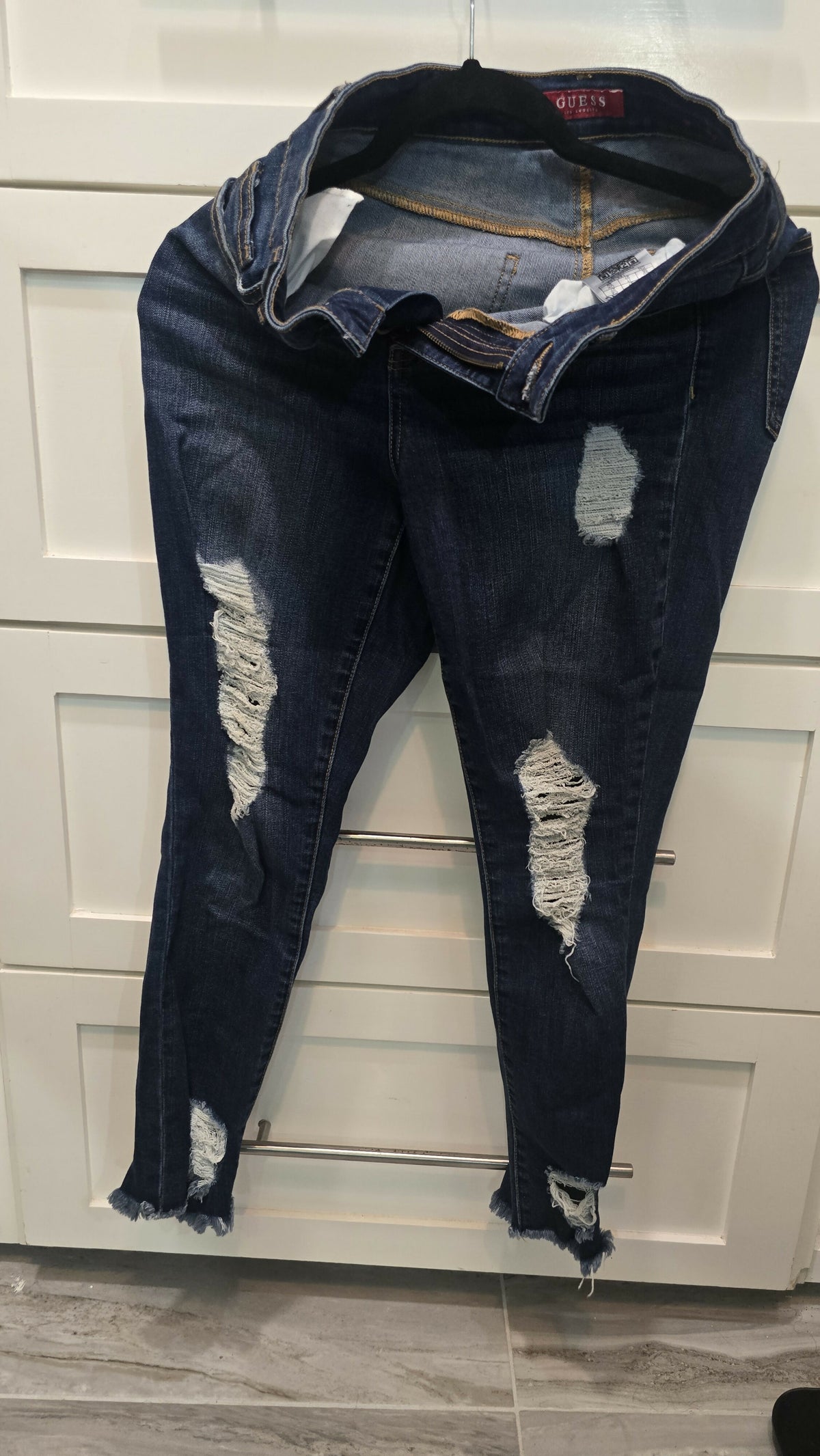 Distressed ankle skinny jeans