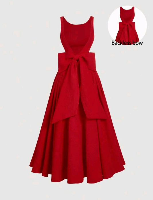 OPEN BACK DRESS WITH LARGE BOW